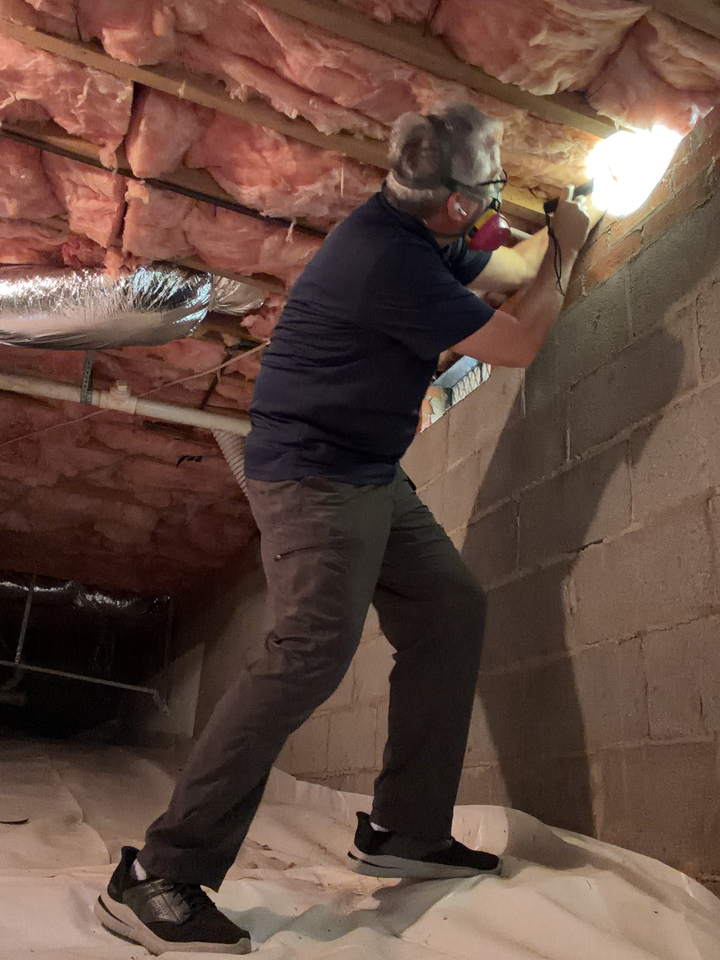 Inspector examining a home system on-site